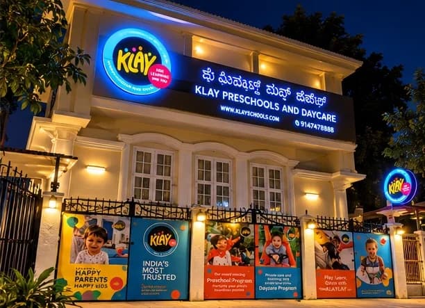 KLAY Preschools and Daycare illuminated facade with printed fence banners